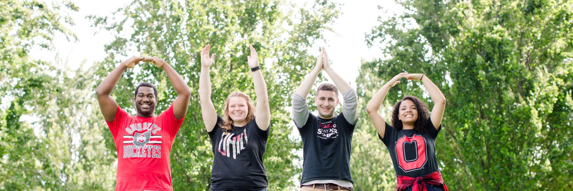 Four students spelling OHIO with their arms