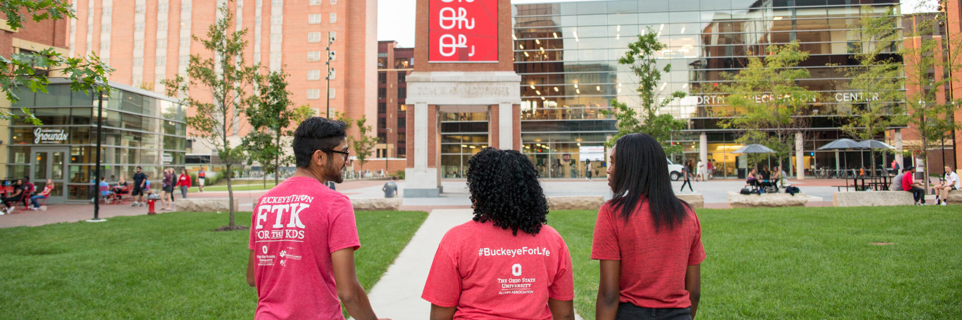 Students walking on North campus by the clock tower on Ohio State campus